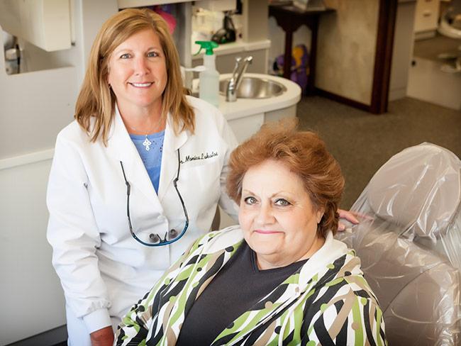 Dentist and Seated Patient